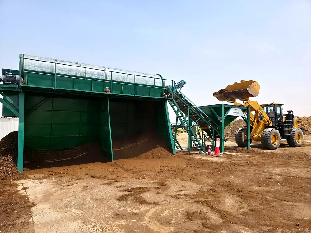 The screening plant running, refined compost discharging below