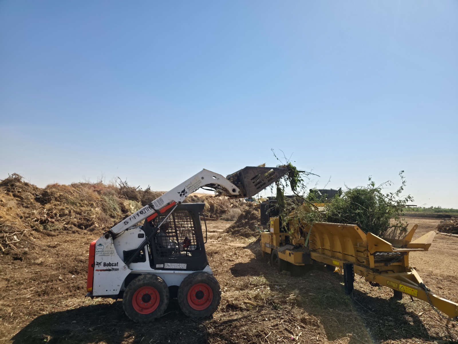 Green waste being loaded into a shredder at the Riyadh facility
